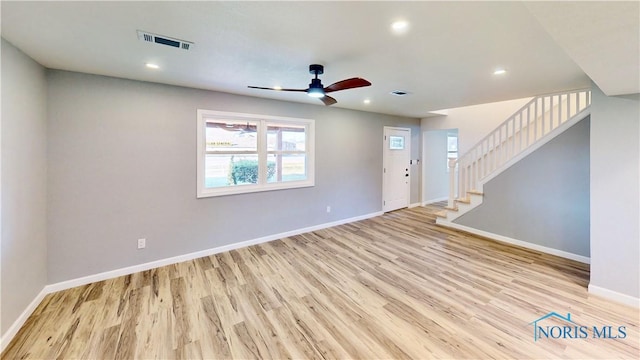 unfurnished living room with ceiling fan and light hardwood / wood-style floors