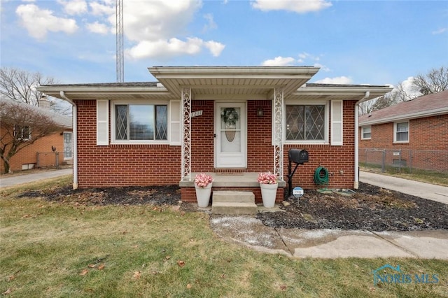 bungalow with a front yard