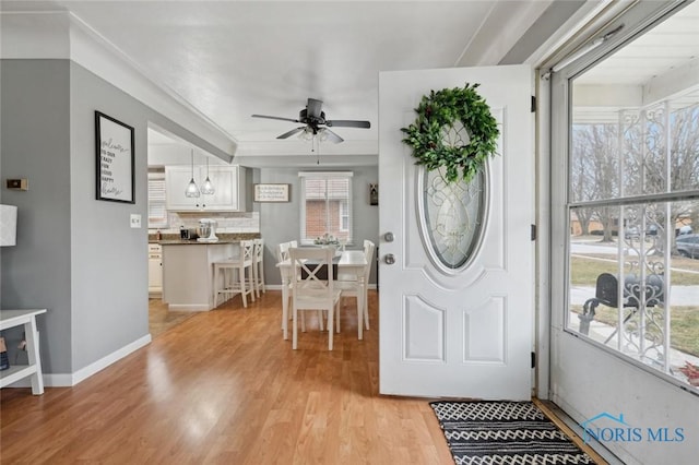 entrance foyer featuring ceiling fan and light hardwood / wood-style floors