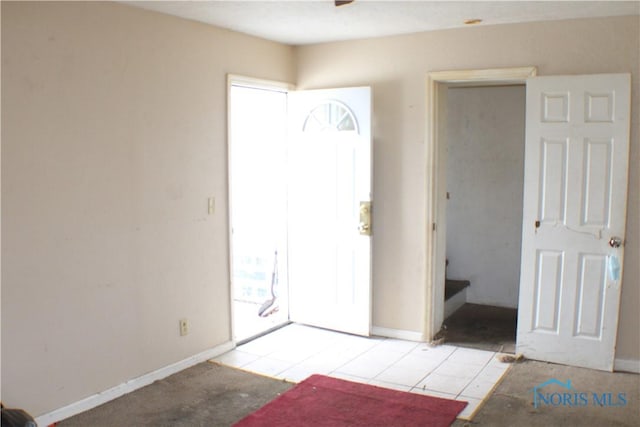 entrance foyer featuring light tile patterned floors