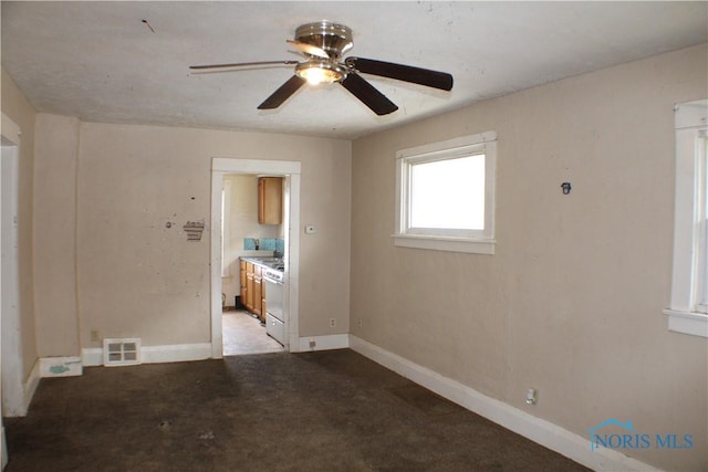 unfurnished room featuring ceiling fan