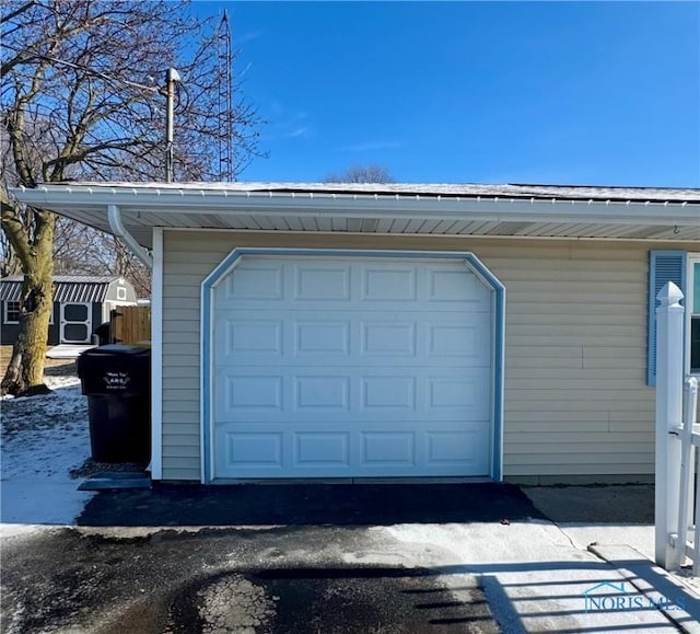 view of snow covered garage