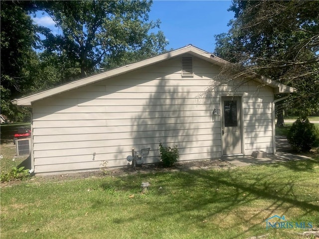 view of home's exterior with a yard