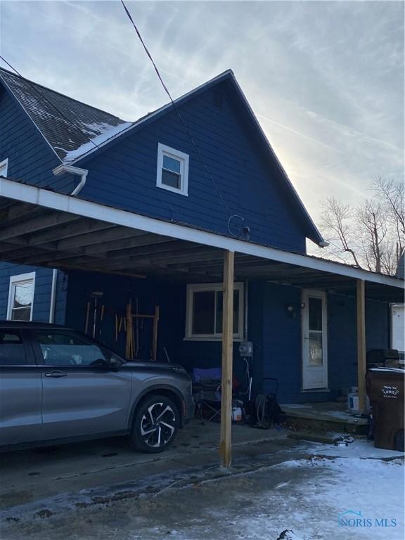 view of front of home with a carport