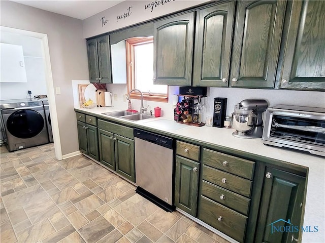 kitchen with dishwasher, sink, and washing machine and clothes dryer