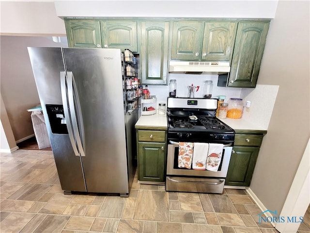 kitchen featuring tasteful backsplash, appliances with stainless steel finishes, and green cabinets