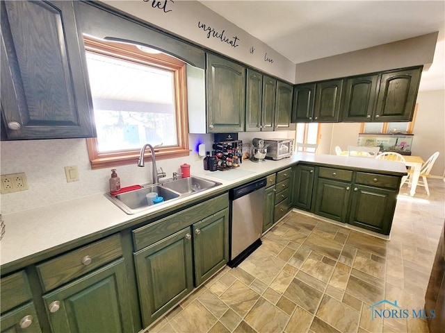 kitchen featuring dishwasher, sink, and kitchen peninsula