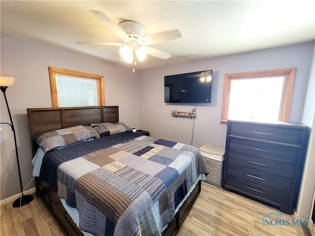 bedroom featuring ceiling fan and light hardwood / wood-style flooring