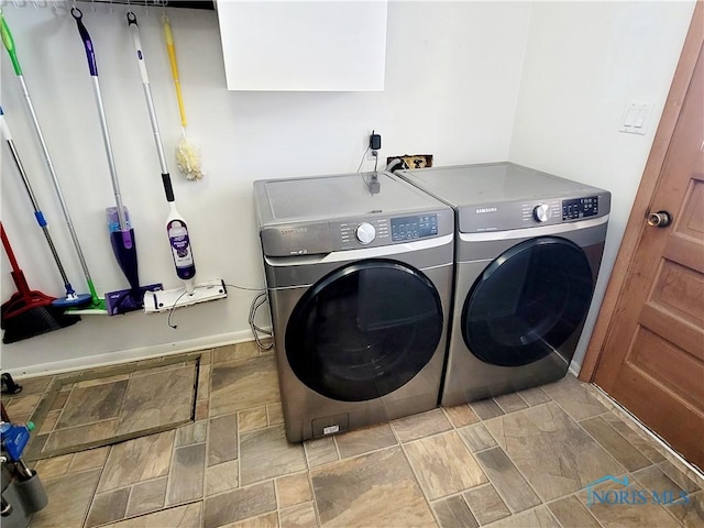 laundry area with washing machine and dryer