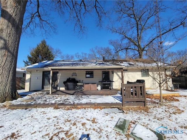 view of snow covered house