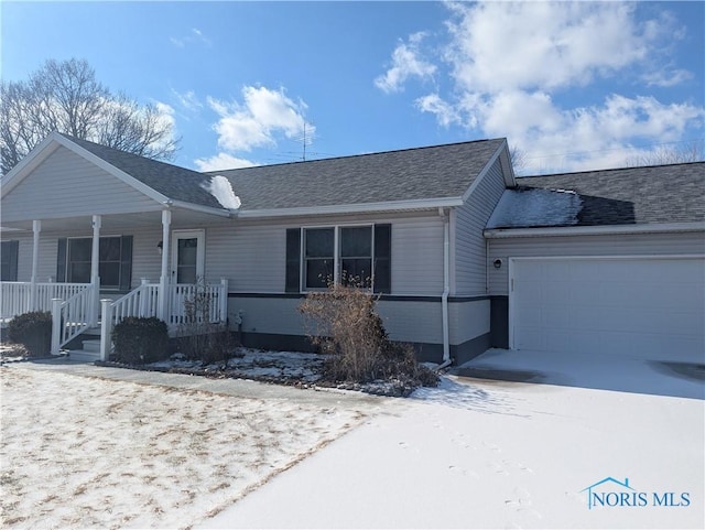 single story home featuring a garage and covered porch