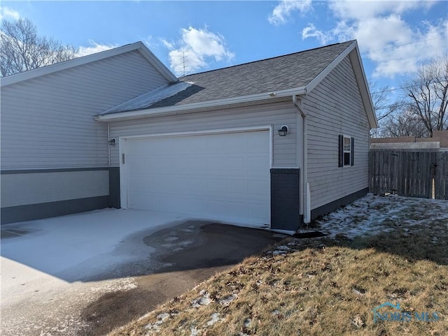 view of property exterior featuring a garage