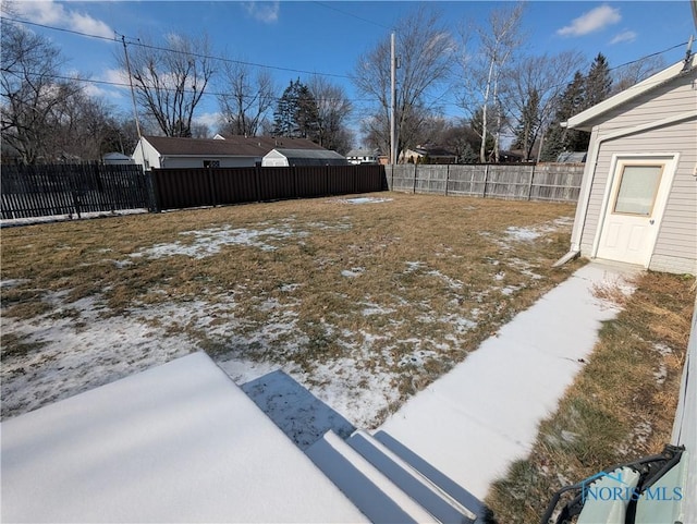 view of yard layered in snow