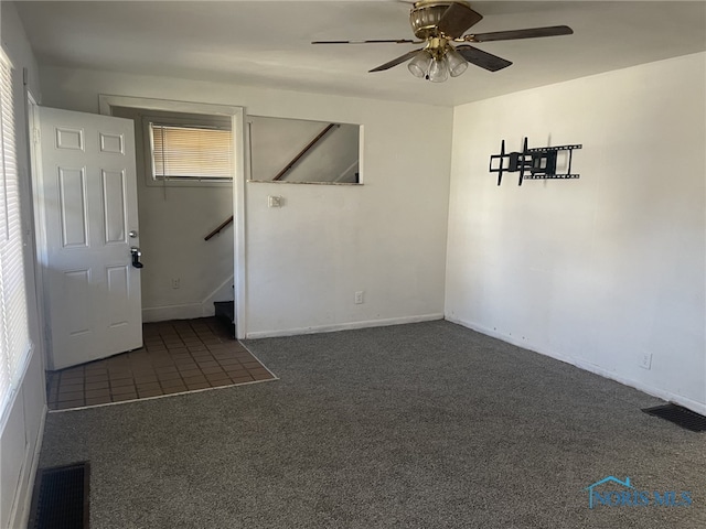 1455 Oak St, Toledo, OH 43605 - carpeted empty room featuring a ceiling fan, a wealth of natural light, and visible vents