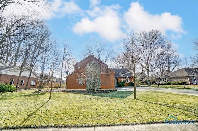 view of home's exterior featuring a lawn