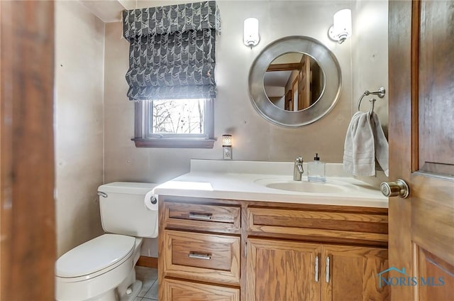 bathroom with vanity and toilet