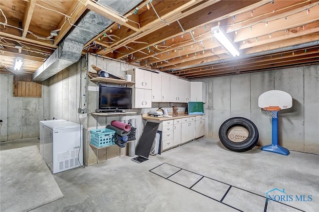 basement featuring fridge