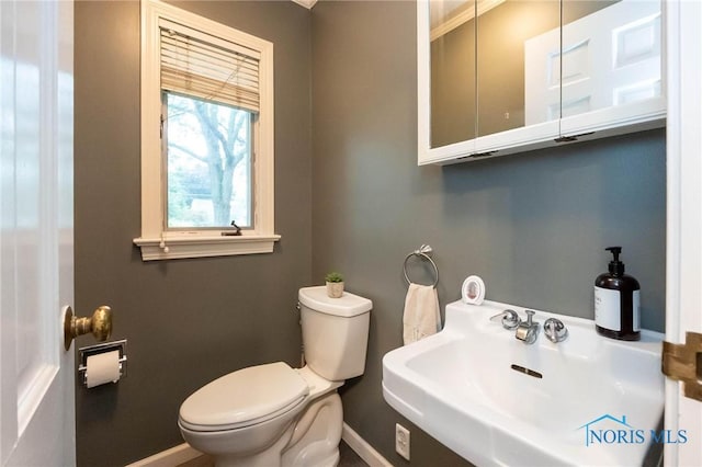 bathroom with sink and toilet