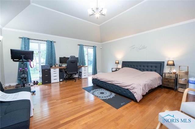 bedroom featuring multiple windows, ornamental molding, hardwood / wood-style floors, and an inviting chandelier