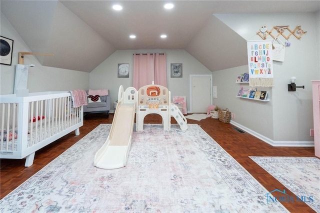 bedroom with lofted ceiling and dark parquet floors