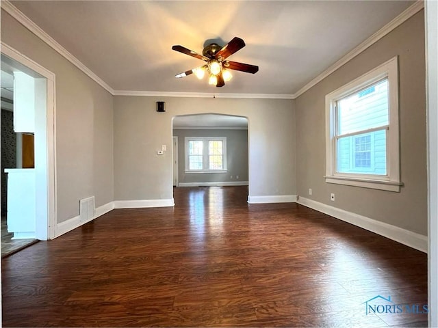 unfurnished room with ceiling fan, ornamental molding, and dark hardwood / wood-style floors