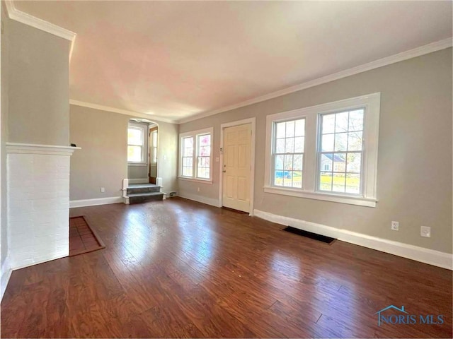 unfurnished living room with dark wood-type flooring and ornamental molding