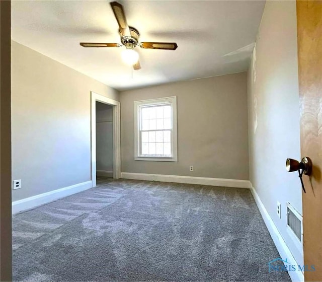 carpeted empty room with ceiling fan