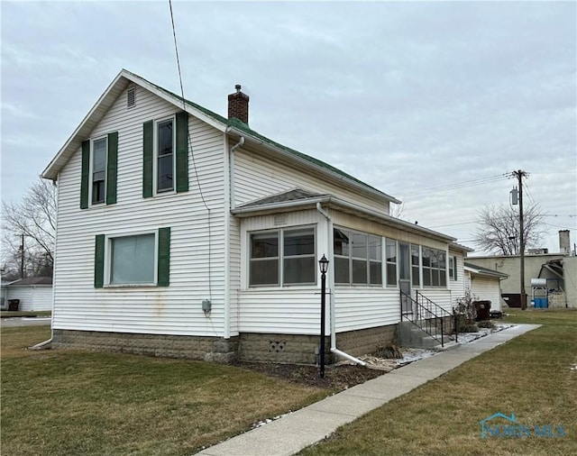 view of property exterior featuring a lawn