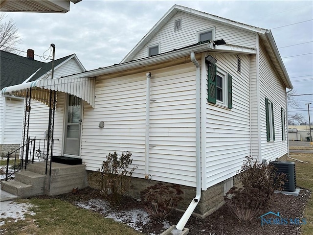 view of property exterior with cooling unit