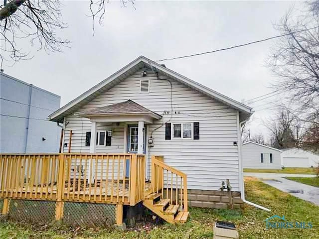 bungalow featuring a wooden deck