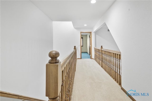 hallway with light carpet