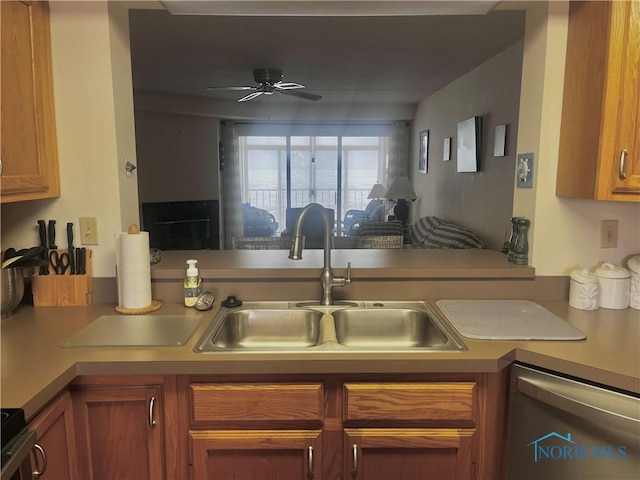 kitchen featuring stove, ceiling fan, sink, and dishwasher