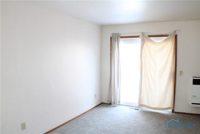 unfurnished room featuring carpet floors