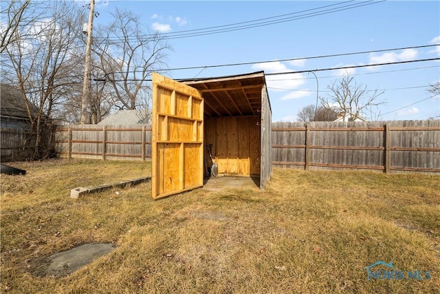 view of outbuilding with a lawn