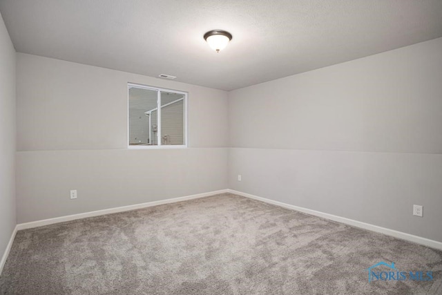 unfurnished room with carpet flooring