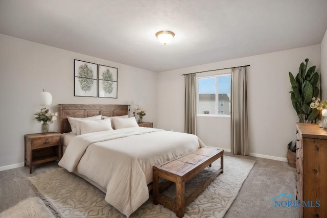 bedroom featuring light colored carpet