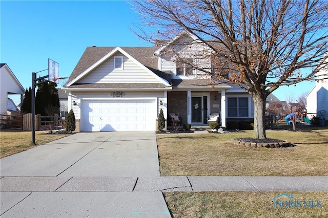 front of property featuring a garage and a front yard