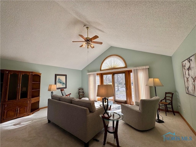 living room featuring light carpet, a textured ceiling, vaulted ceiling, and ceiling fan