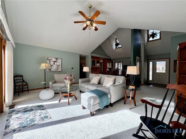 carpeted living room with lofted ceiling and ceiling fan