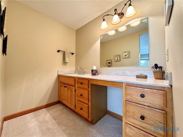 bathroom with vanity and a textured ceiling