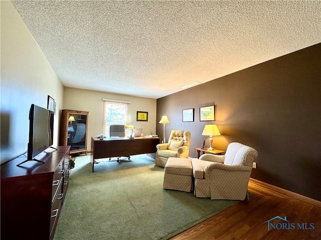 office space with hardwood / wood-style flooring and a textured ceiling