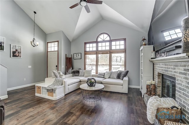 living room with a brick fireplace, high vaulted ceiling, ceiling fan, and dark hardwood / wood-style floors