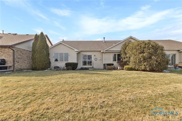 view of front of house with a front lawn