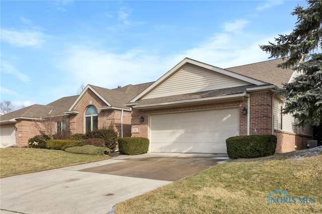 single story home featuring cooling unit, a garage, and a front yard