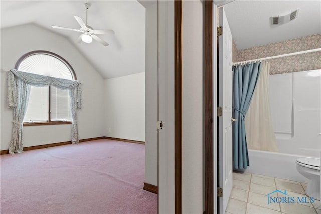 bonus room featuring ceiling fan, light colored carpet, and vaulted ceiling