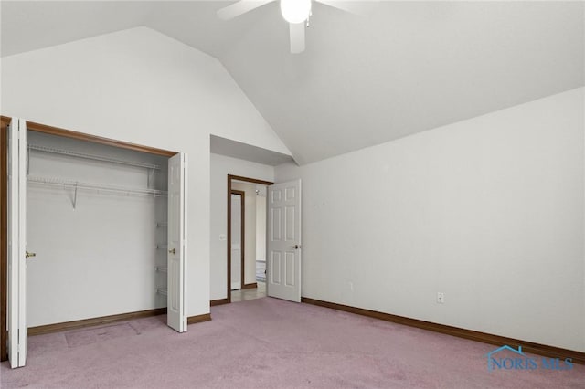 unfurnished bedroom with high vaulted ceiling, light carpet, ceiling fan, and a closet