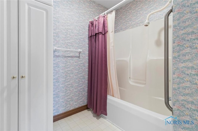 bathroom featuring tile patterned flooring and shower / bath combination with curtain