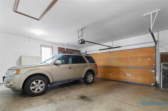 garage featuring a garage door opener