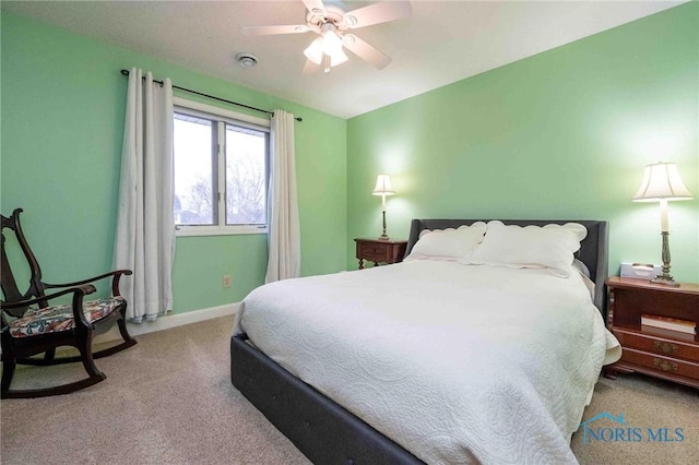 bedroom with light colored carpet and ceiling fan