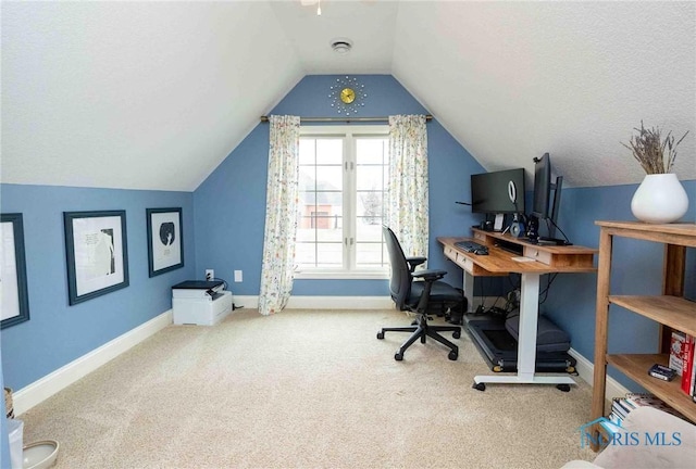 carpeted office space with lofted ceiling and a textured ceiling